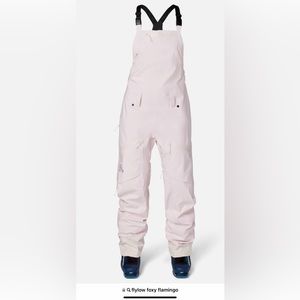 Flylow Foxy ski/snowboard bibs. Women’s size XL in Pink Flamingo (Light pink)